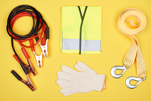flat lay with arrangement of automotive accessories isolated on yellow - Photo, Image