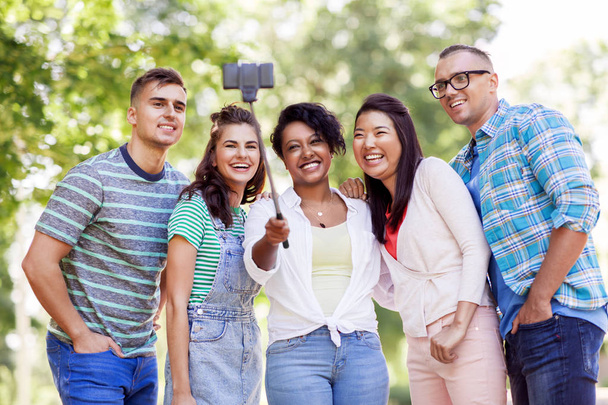 international friends taking selfie in park - Fotografie, Obrázek