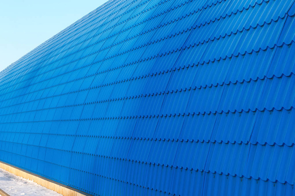 Perspective wall hangar from blue tiles. Large semicircular building on the production base - Foto, Imagem