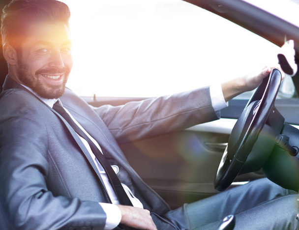 Handsome businessman in the drivers seat in his car - Fotoğraf, Görsel