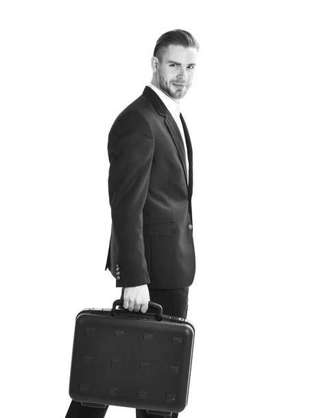 Man carries black case in hand. Business people concept. - 写真・画像