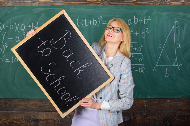 Hiring teachers for new school year. Woman teacher holds blackboard inscription back to school. Looking committed teacher complement qualified workforce educators. Back to school teachers recruitment - Photo, image
