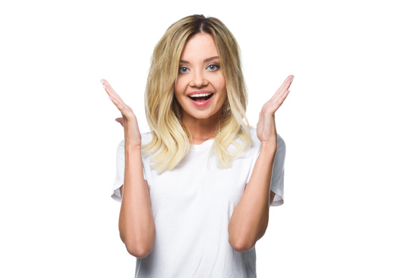 portrait of excited attractive girl in white shirt gesturing isolated on white - Φωτογραφία, εικόνα