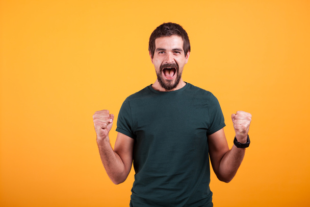 Joyful screaming excited man with his mouth open from emotions - Photo, Image