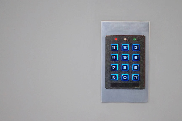 Secure password on keyboard for opening home house door. Password code Security keypad system protected in Public Building. The security code combination to unlock the door - Photo, Image