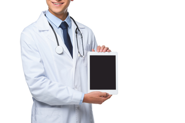 白で隔離空白の画面とタブレットを保持している若い医者のクロップ撮影 - 写真・画像