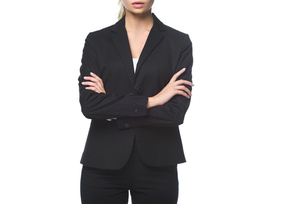 cropped shot of young businesswoman with crossed arms isolated on white - Zdjęcie, obraz