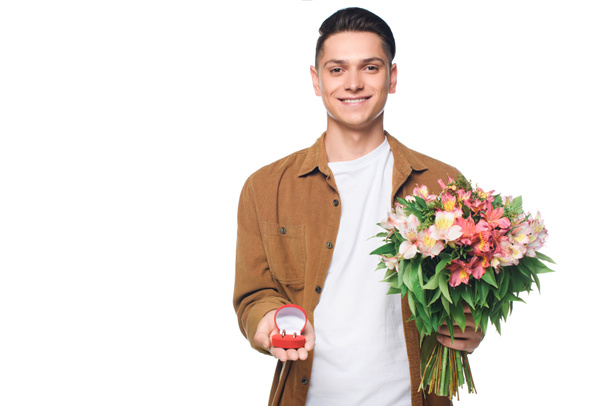 happy young man with bouquet making proposal isolated on white - Foto, imagen