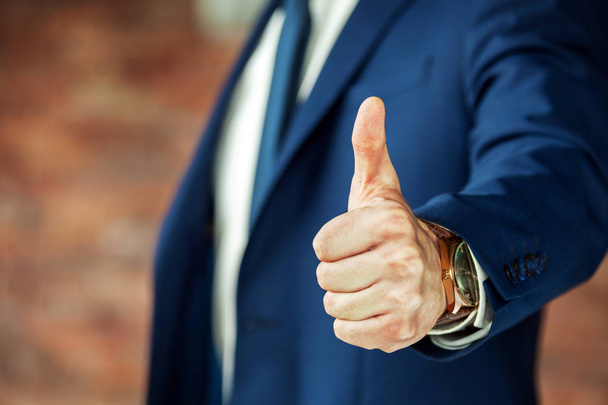 Cropped shot of business person showing thumb up. - Fotó, kép