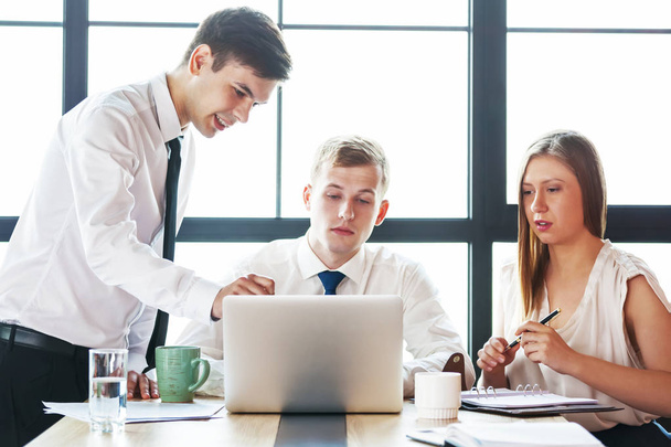 Group of young business team working at a table - Photo, image