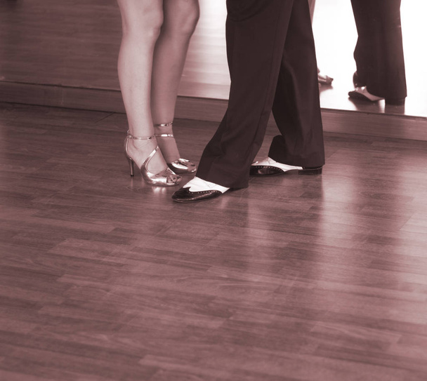 Ballroom dance salsa dancer instructors man and woman couple dancing in shcool rehearsal room - Photo, Image