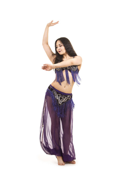 Attractive brunette girl with long hair dancing belly dance. on isolated white background. - Fotografie, Obrázek