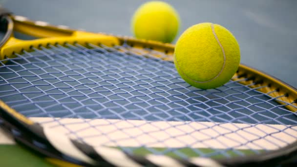 Close up of tennis equipment on the court. Sport, recreation concept. - Footage, Video