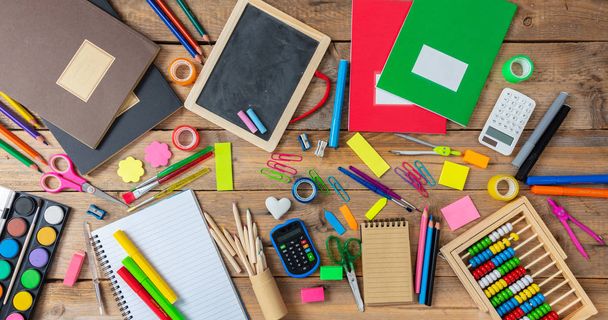 Back to school concept. School supplies on wooden background, top view - Фото, зображення