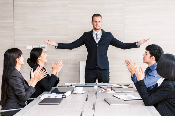 Successful business people clapping hands in the meeting - Photo, Image
