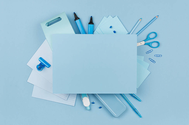 Concept art workplace for designers - blue color office accessories and blank letterhead for text on soft light blue background, top view. - Φωτογραφία, εικόνα
