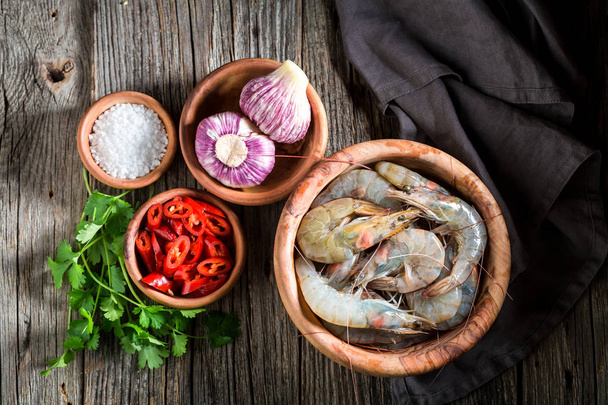 Ingredients for tasty homemade shrimp on wooden bowl - Фото, зображення