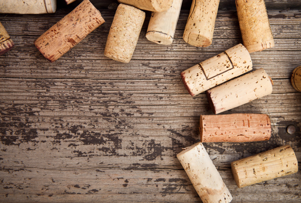 Dated wine bottle corks on the wooden background - Photo, Image
