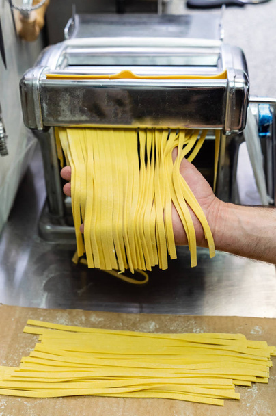 chef making pasta, close up - 写真・画像
