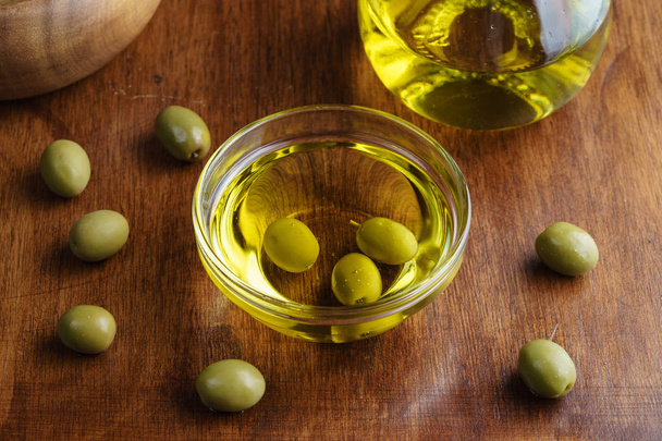 Extra virgin olive oil in glass transparent bowl - Photo, Image