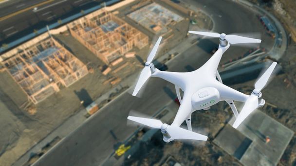 Unmanned Aircraft System (UAV) Quadcopter Drone In The Air Over Construction Site. - Photo, Image