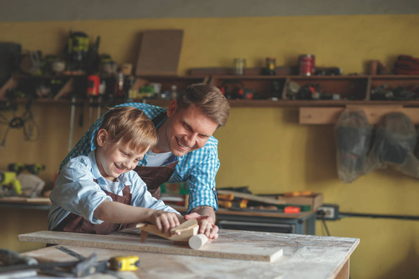 Father and son at work in carpentry - Photo, Image