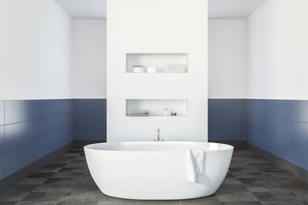 Modern bathroom interior with white and blue walls, a tiled floor, a white bathtub and shelves in the wall. 3d rendering mock up - Foto, imagen