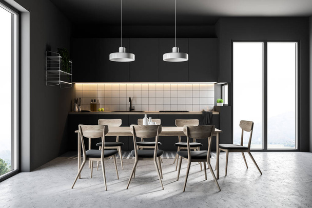 French window kitchen with black walls, a concrete floor, a table with chairs and black countertops. 3d rendering - Foto, afbeelding