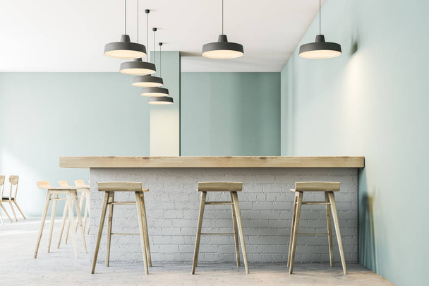 Bar with stools in a modern restaurant interior with gray green walls, a concrete floor and lamps. 3d rendering mock up - Fotografie, Obrázek