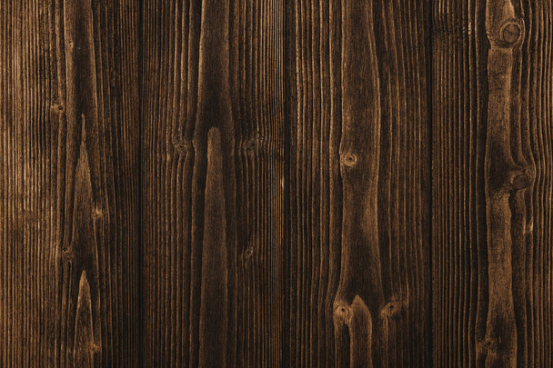 Текстура темно-коричневого дерева с естественным полосатым рисунком для фона, деревянная поверхность для добавления текста или оформления художественных работ
 - Фото, изображение