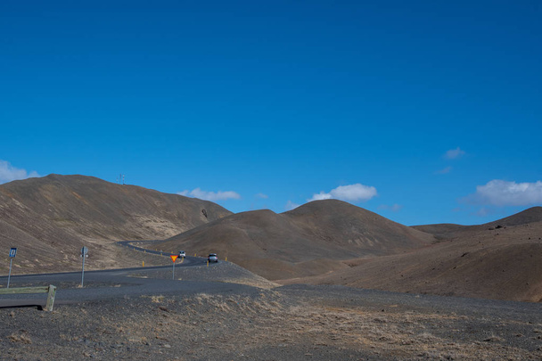 Road through Namaskard mountain pass in North Iceland - Photo, Image