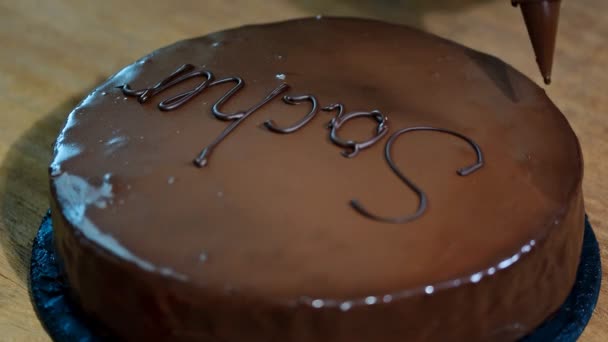 Chocolate cake Sacher on a wooden table. - Footage, Video