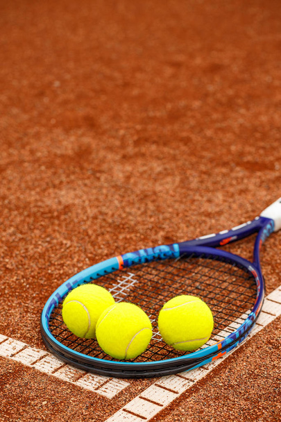 Close up view of tennis racket and balls on the clay tennis court - Photo, Image