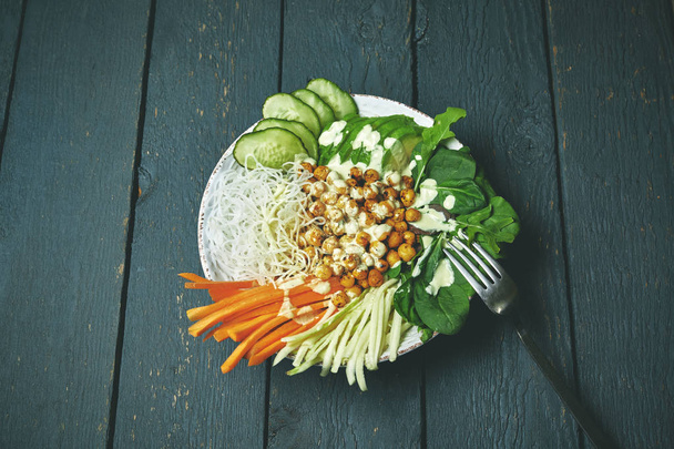 buddha bowl with vegan food, fried chickpeas, rice noodles with wegetables - Zdjęcie, obraz