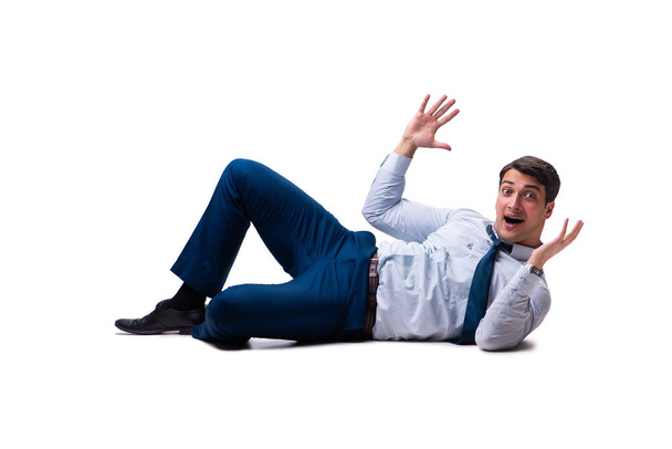 Бізнесмен лежить на підлозі ізольований на білому
 - Фото, зображення