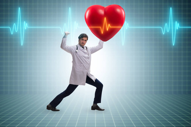 Médecin cardiologue soutenant la ligne cardiaque cardiogramme - Photo, image