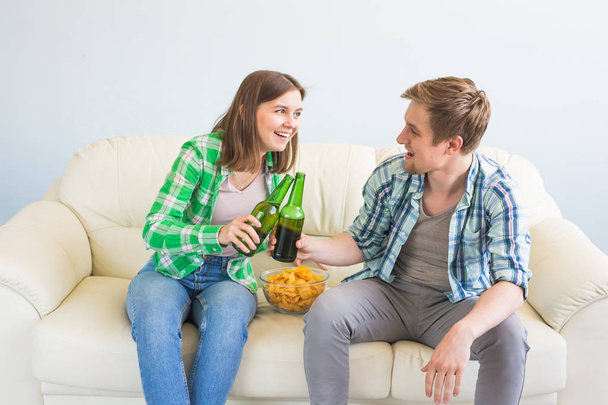 Soccer world cup concept - Modern couple looking excited and happy watching sport game on tv - Photo, image