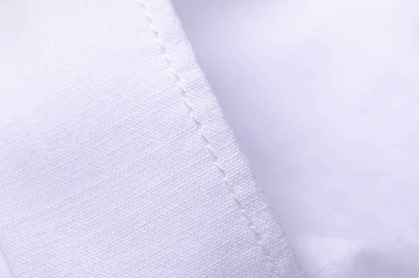 White shirt fabric macro material clothes detail on blur background - Φωτογραφία, εικόνα