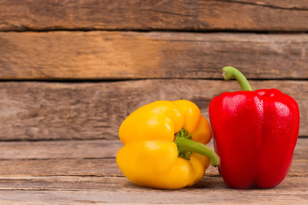 Fresh ripe bell peppers on wood. - Photo, Image