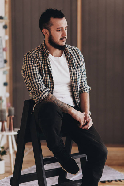Handsome bearded man in checkered shirt - Фото, зображення