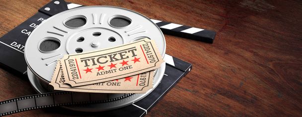 Cinematography concept. Film reel with retro cinema tickets on top, on a movie clapper, wooden background with copy space, banner, 3d illustration. - Photo, Image