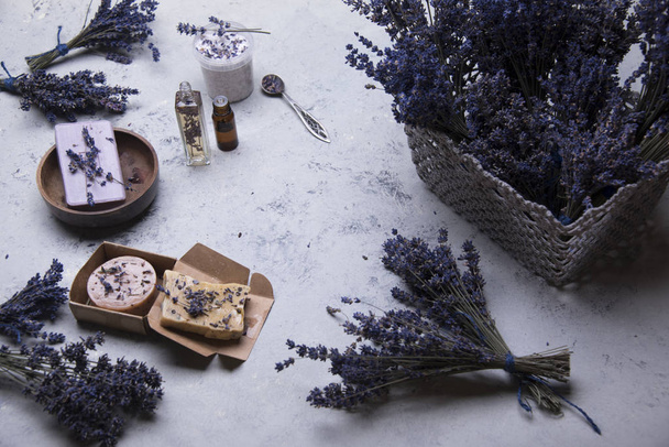 cosmetic products from dried lavender on light background - Foto, Imagem