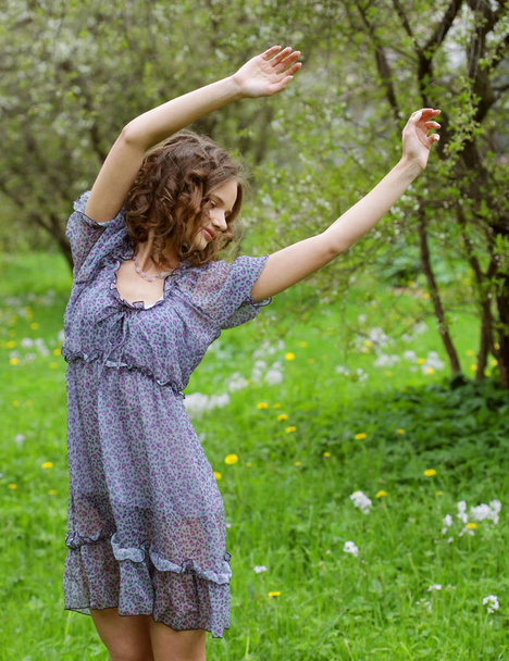  young woman in dress relaxing in  garden  - Fotografie, Obrázek
