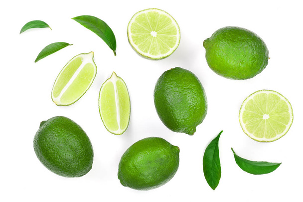 sliced lime with leaves isolated on white background. Top view. Flat lay pattern - Foto, Imagen