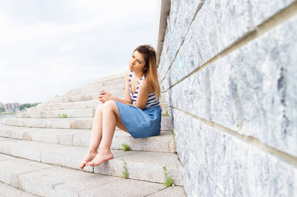 girl sits on the steps of the stairs - Photo, image