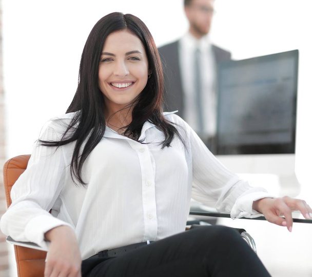 successful young business woman sitting at workplace - Photo, image