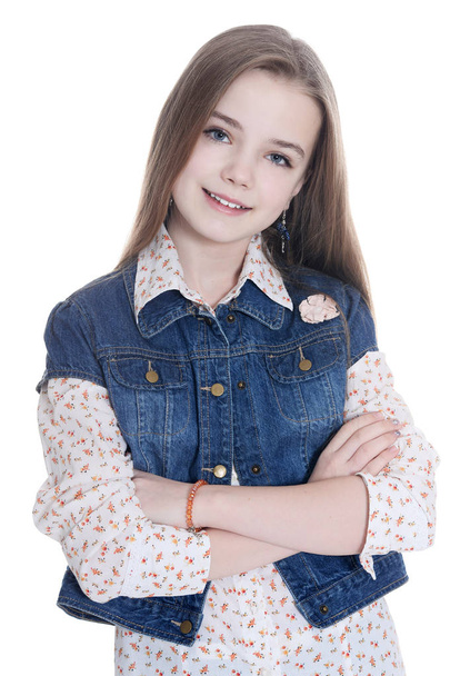 Happy little girl posing with crossed arms isolated on white background - Foto, afbeelding