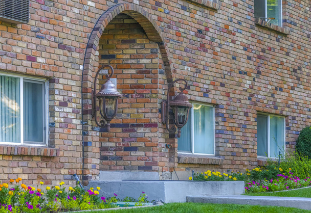 Arched entrance of brick residential building - Photo, Image