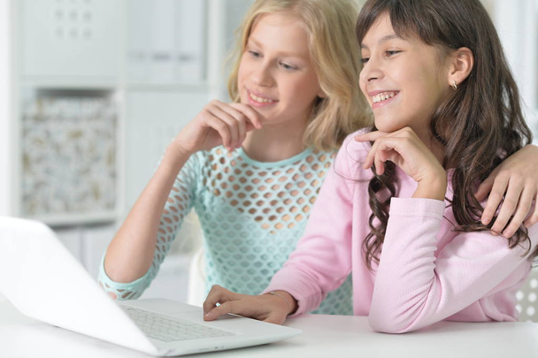 Two girls using laptop - Photo, Image
