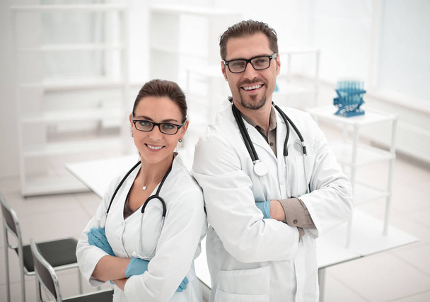 portrait of two young scientists on the background of the laboratory - Foto, immagini